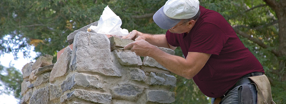 Chimney mason repointing stone grout